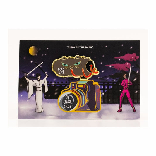 Dead Cat microphone glow in the dark enamel pin with packaging