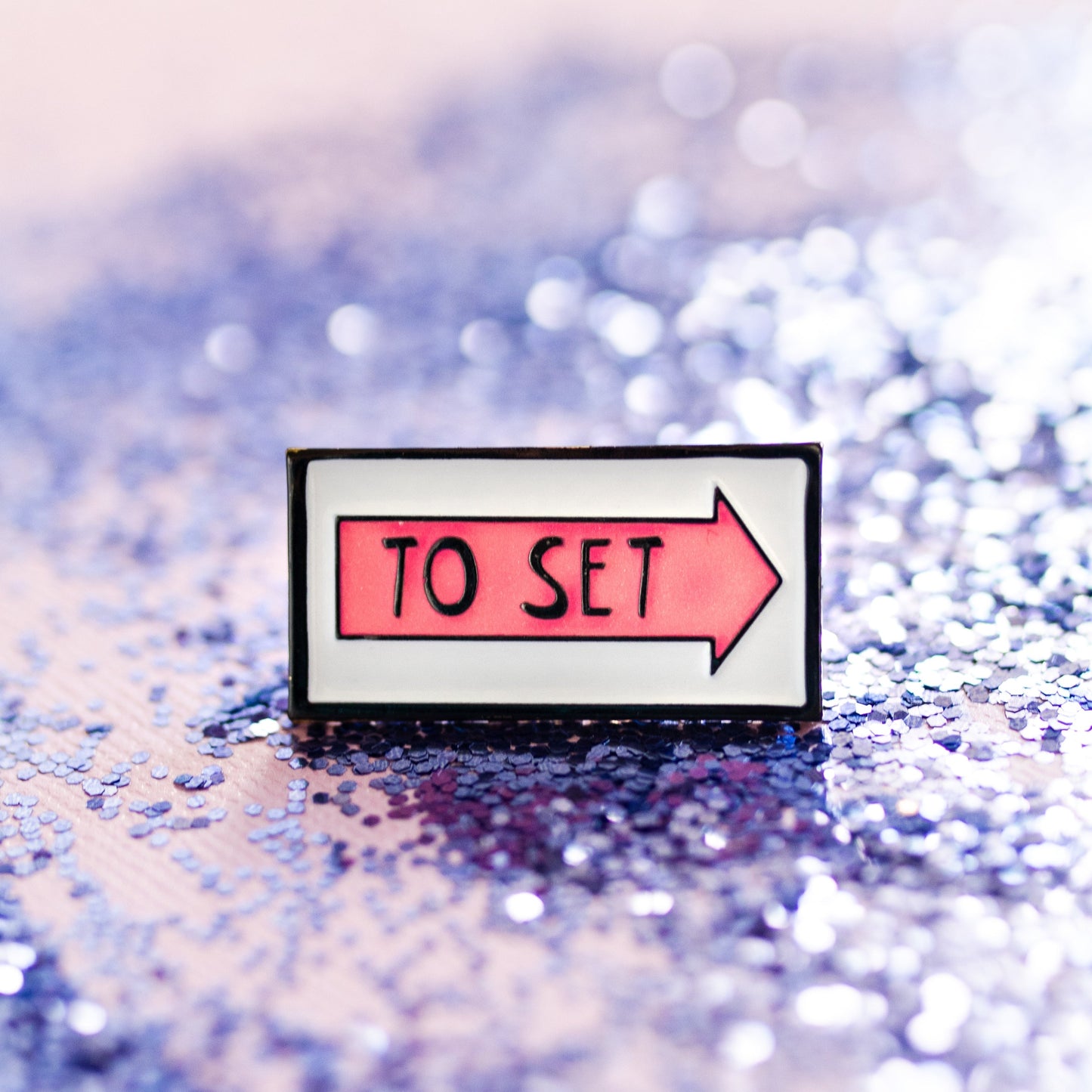 To set pink glow in the dark  film arrow sign enamel pin