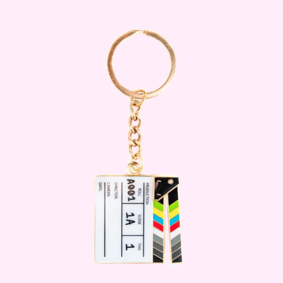 A movable clapperboard keychain with test "A001 1A 1"