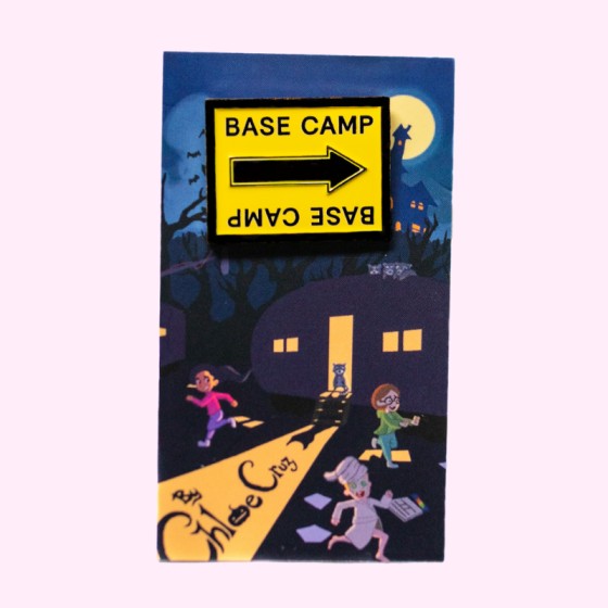 Base Camp Film Location black and yellow arrow sign enamel pin with packaging