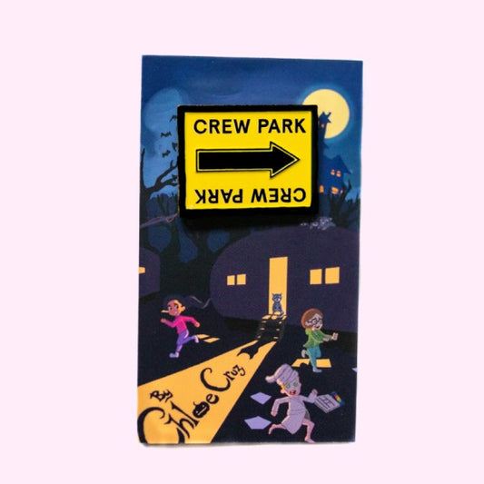 Crew Park black and yellow film location arrow sign enamel pin with packaging